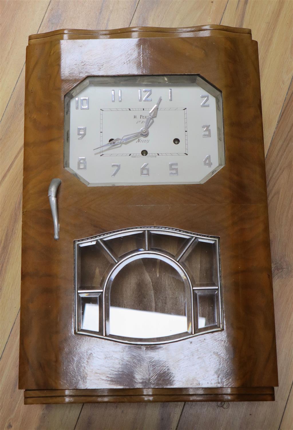 A French Art Deco walnut and chrome musical wall clock, dial signed H.Perrin, Nevers, height 59cm